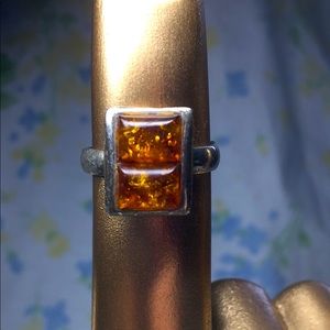 Amber in silver setting ring